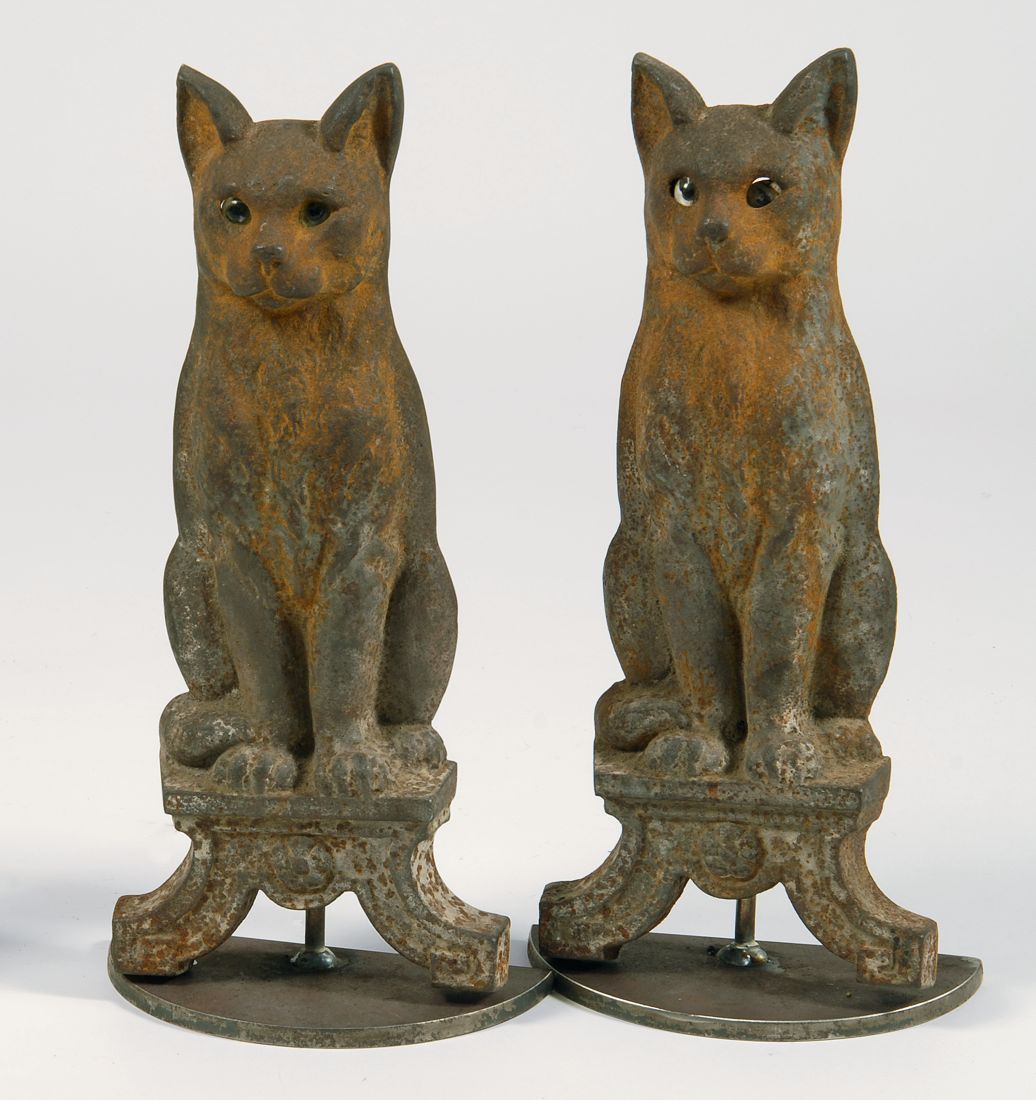 Appraisal: PAIR OF CAST IRON CAT-FORM ANDIRONS With glass eyes Rust