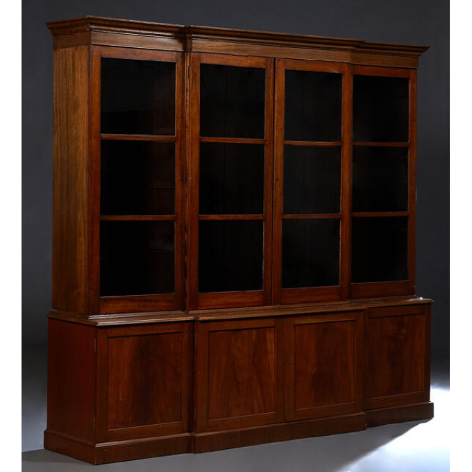 Appraisal: Georgian Style Carved Mahogany Breakfront Bookcase th c the stepped