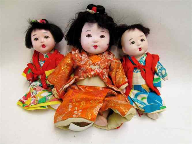 Appraisal: THREE ORIENTAL DOLLS Japanese baby dolls shell heads glass eyes