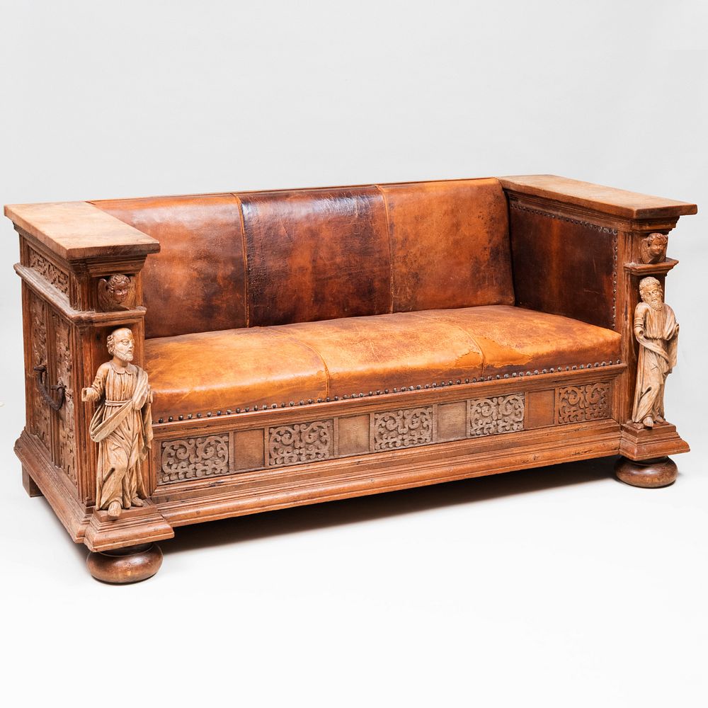 Appraisal: Continental Carved Oak and Leather Figural Sofa Adapted composed of