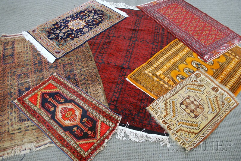 Appraisal: Seven Rugs th century an Afghan ft in x ft