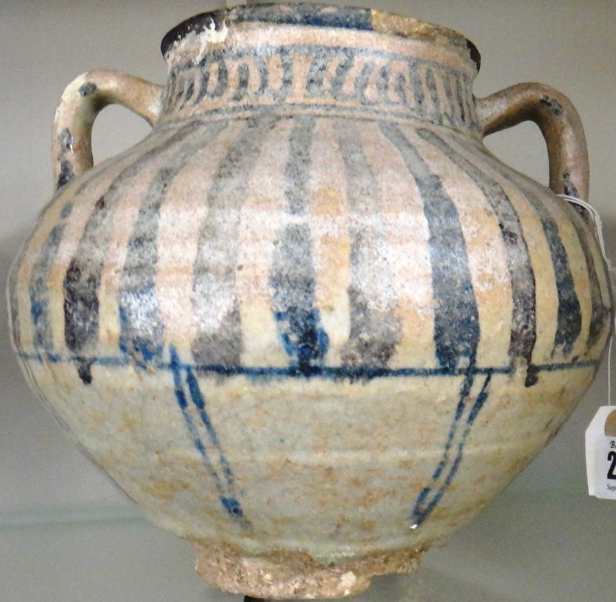 Appraisal: A Persian pottery two-handled vase possibly th century of compressed