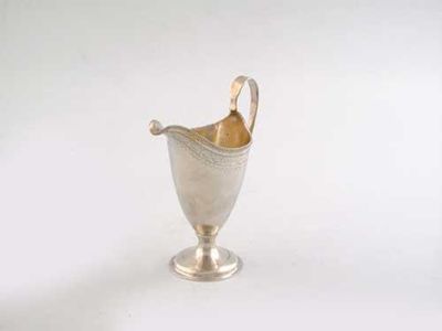 Appraisal: A George III helmet cream jug on circular spreading foot