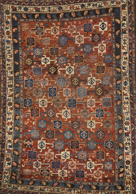 Appraisal: Daghestan Rug Circa Shaded red ground with pinwheel and latchhook