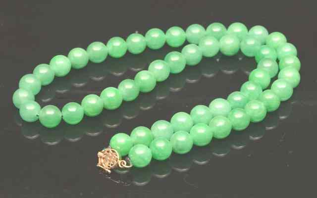 Appraisal: A CHINESE JADE NECKLACE having a gold clasp with Fu