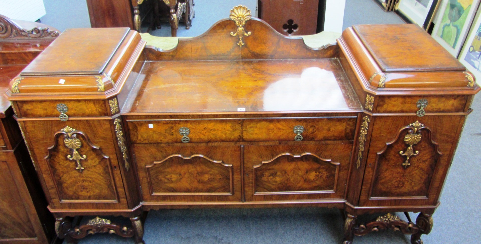 Appraisal: An th century Portuguese style parcel gilt walnut framed pedestal