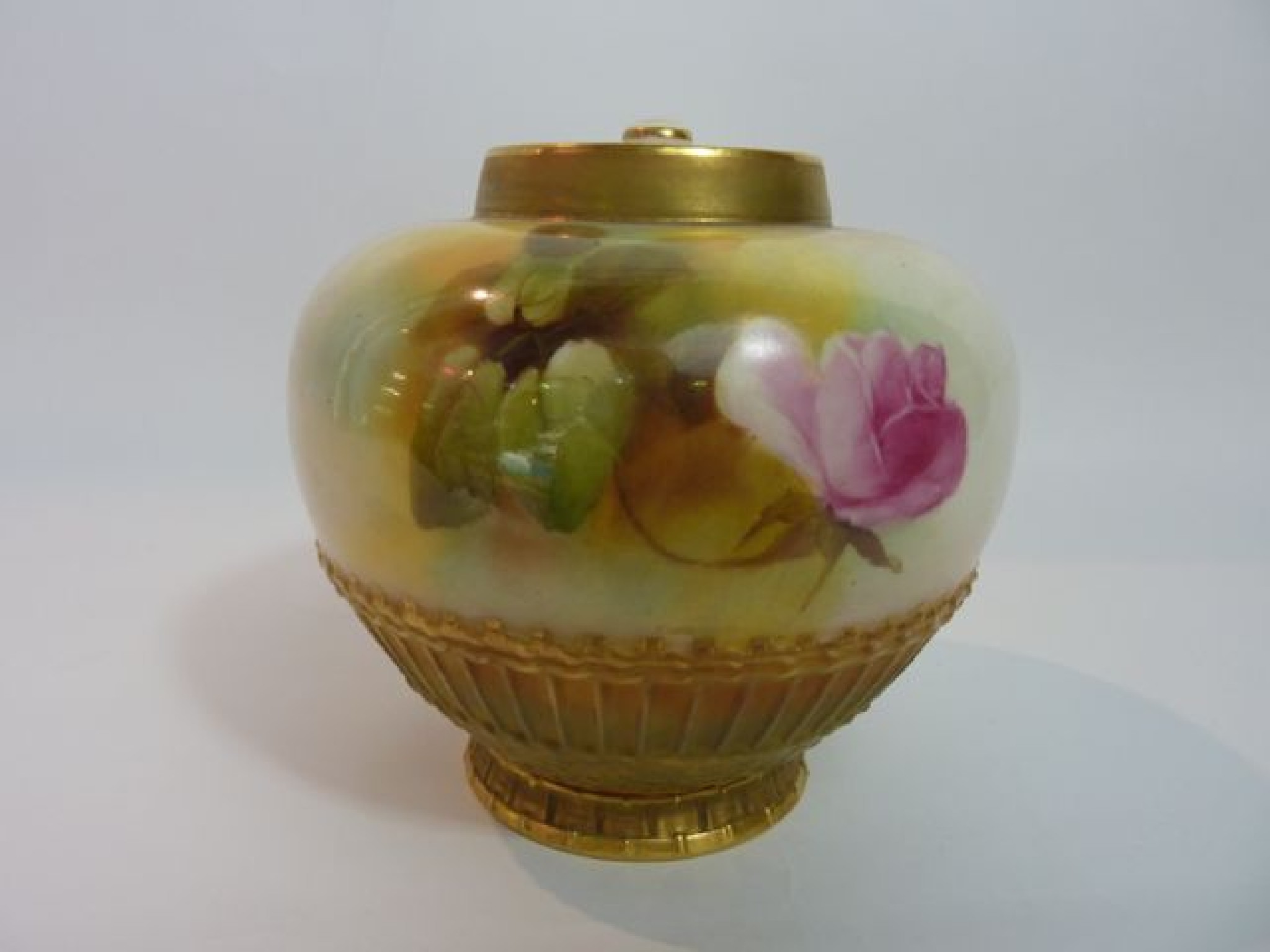 Appraisal: A Royal Worcester vase with gilded simulated basket weave moulding