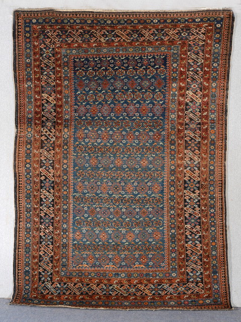 Appraisal: A CAUCASIAN CHICHI BLUE GROUND RUG within an intricately patterned