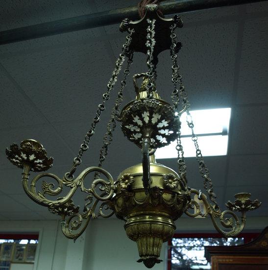 Appraisal: A gilt metal six light electrolier the lotus nozzles over