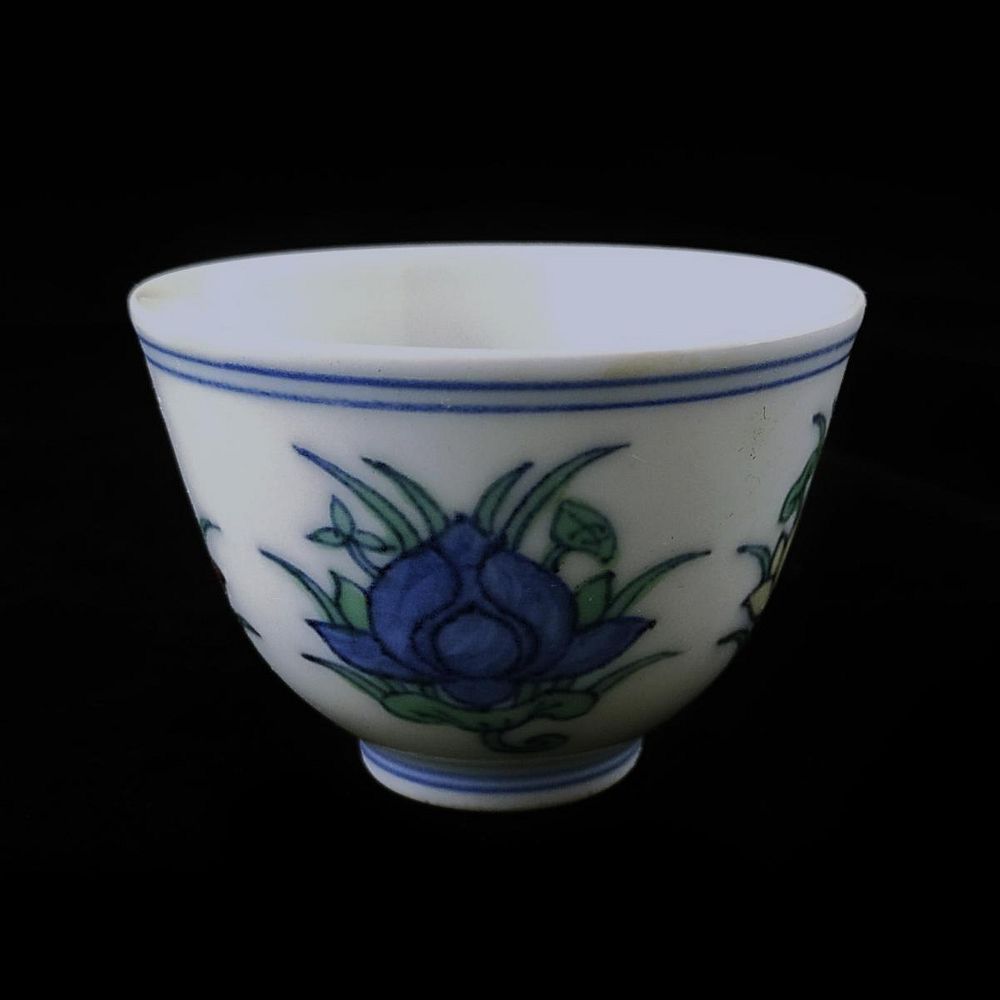 Appraisal: CHINESE DUCAI PORCELAIN LOTUS BLOSSOM WINE CUP Chinese hand painted