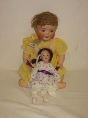 Appraisal: An Armand Marseille bisque headed doll with fixed blue eyes