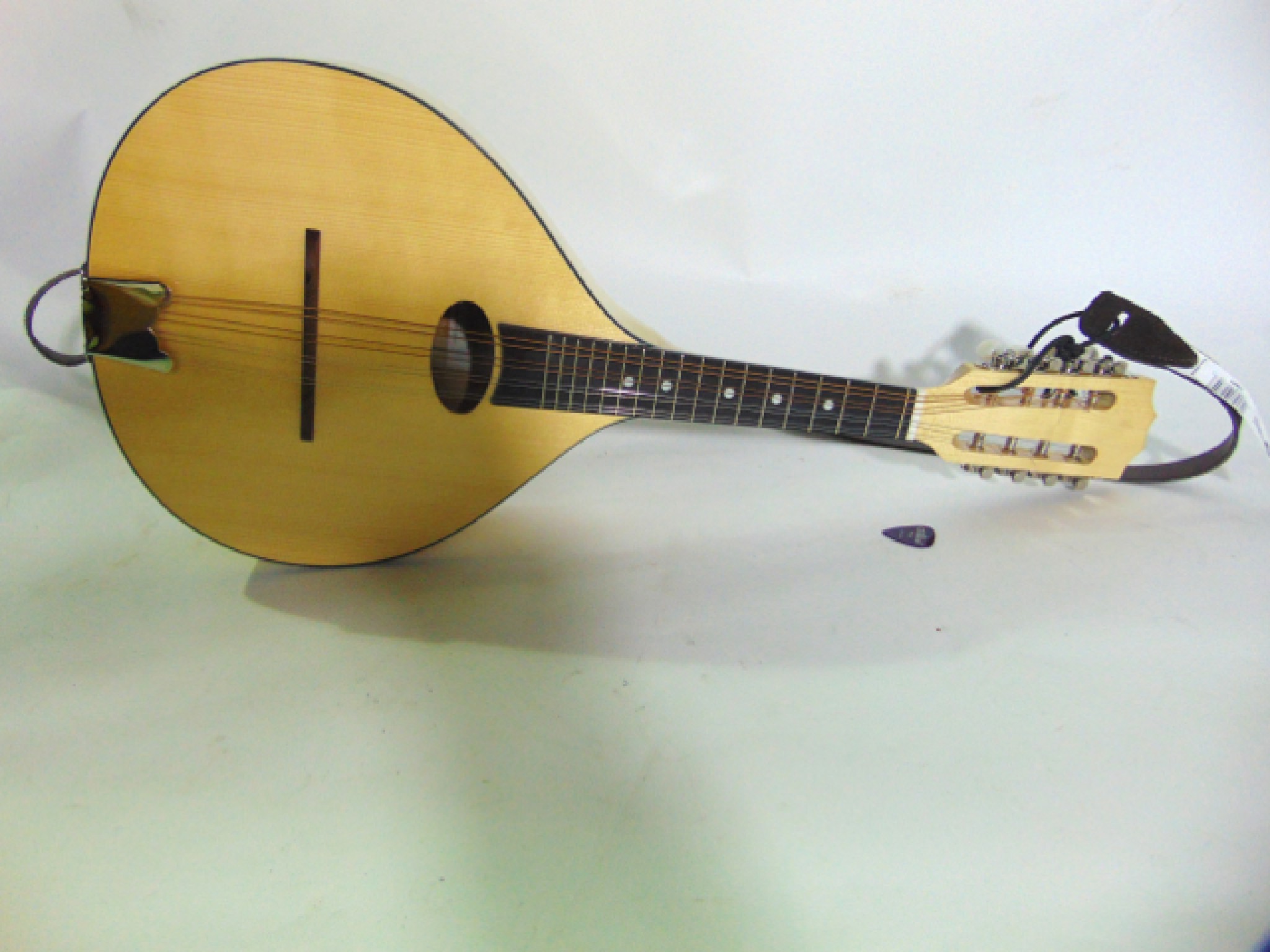 Appraisal: A contemporary Troubadour eight string mandolin with paper label to