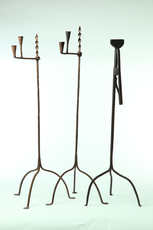 Appraisal: THREE WROUGHT IRON LIGHTING DEVICES American th century All have