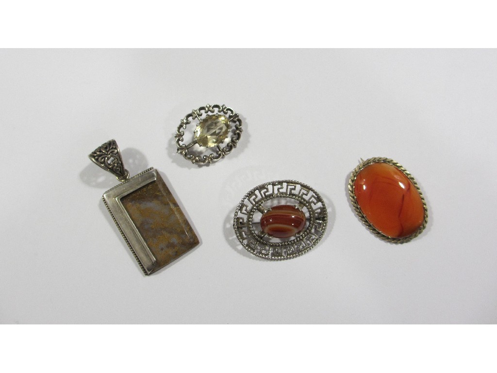 Appraisal: Lot comprising two silver and agate brooches one other with