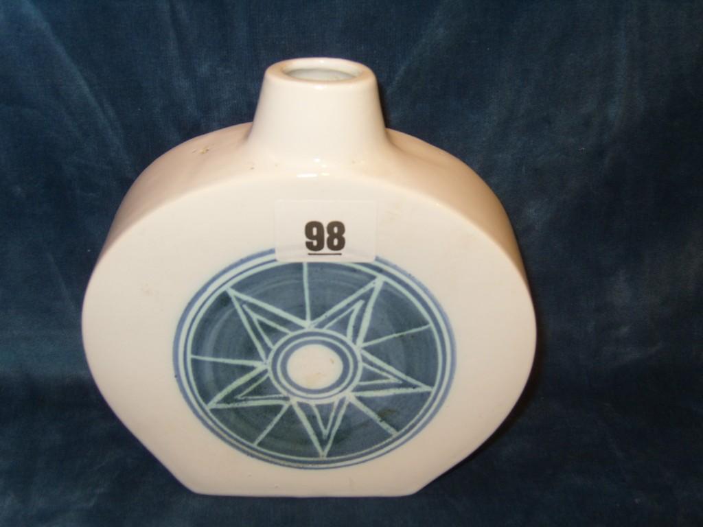 Appraisal: A white ground Troika vase of -sided circular form with