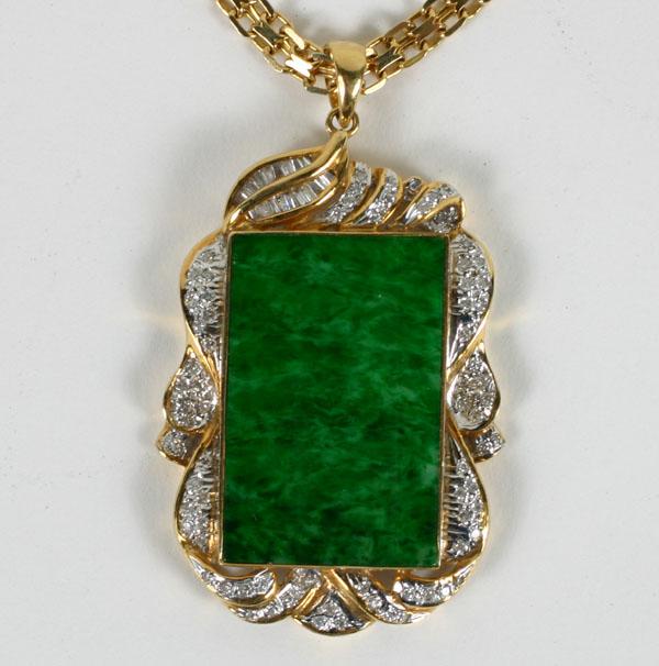 Appraisal: Stamped K yellow gold jade and diamond pendant which is