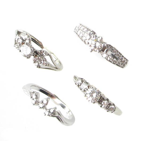 Appraisal: A collection of four diamond and white gold rings four