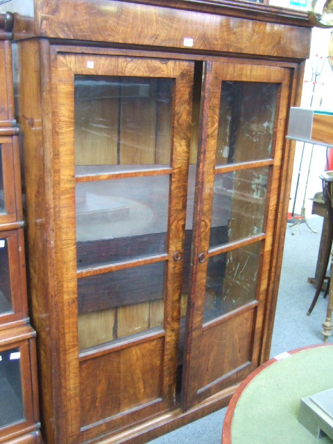 Appraisal: A th century Continental walnut floor standing bookcase the pair