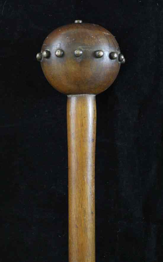 Appraisal: A rhinoceros horn knobkerrie Zulu - the globular handle inset