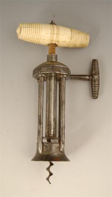 Appraisal: A th century steel four pillar corkscrew with a turned