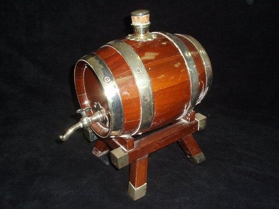 Appraisal: A spirit barrel on stand with plated mounts