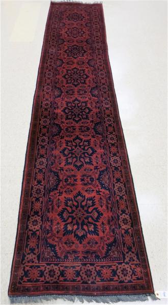 Appraisal: AFGHAN BELOUCHI TRIBAL RUNNER seven medallion and stylized floral design