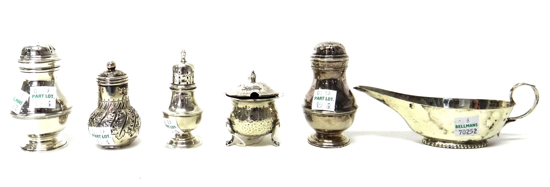 Appraisal: Silver comprising a mustard pot with martele decoration raised on