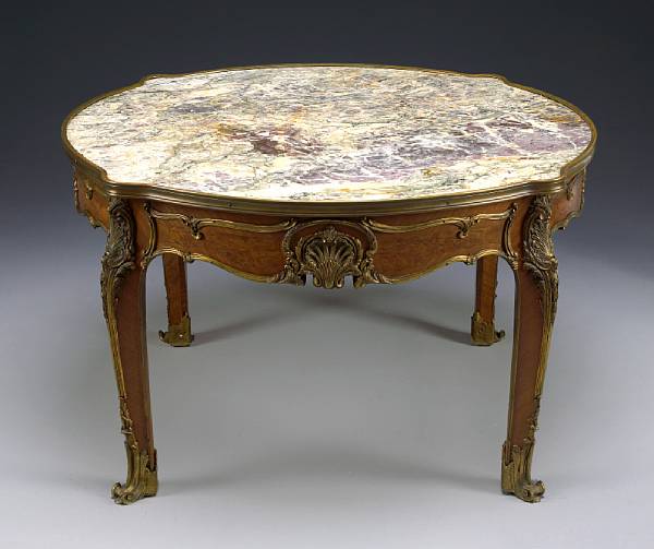 Appraisal: A Louis XV style gilt bronze mounted coffee table early