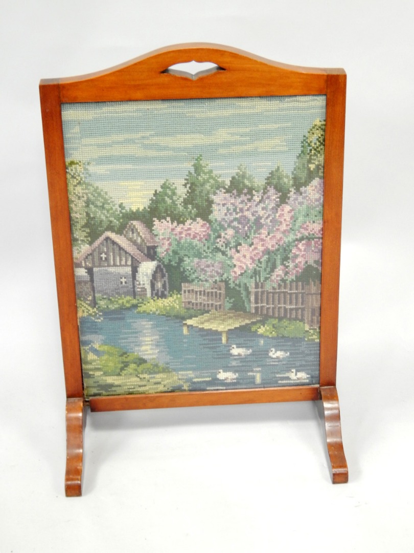 Appraisal: A mahogany fire screen with wool needlework panel of a