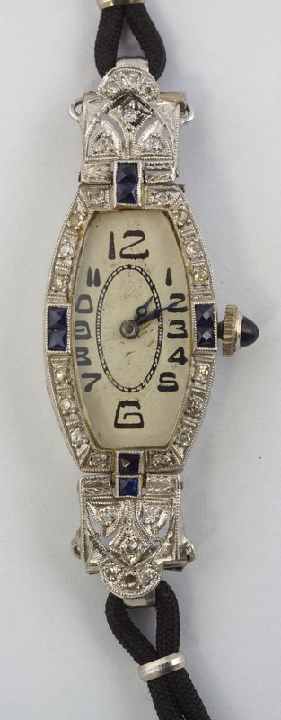 Appraisal: Platinum ladies wristwatch set w diamonds and sapphires about dwt