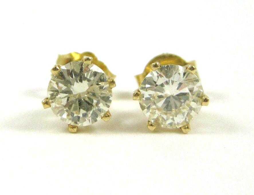 Appraisal: PAIR OF DIAMOND AND YELLOW GOLD EAR STUDS each k