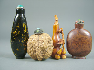 Appraisal: Four Chinese snuff bottles th century one carved from a