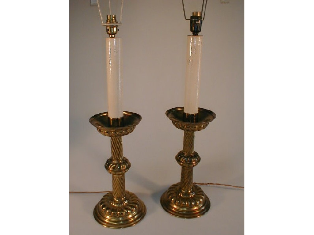 Appraisal: A pair of brass candlestick table lamps with dished sconces