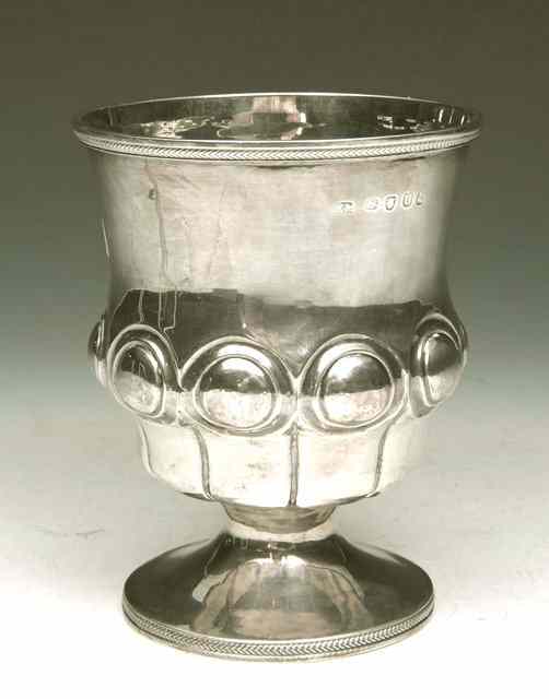 Appraisal: A GEORGE III SILVER GOBLET with chased domed decoration feathered