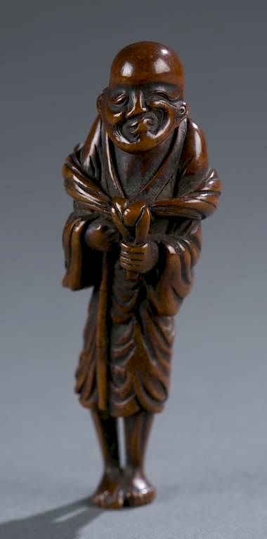 Appraisal: Japanese wood netsuke of a sennin A Japanese wood netsuke