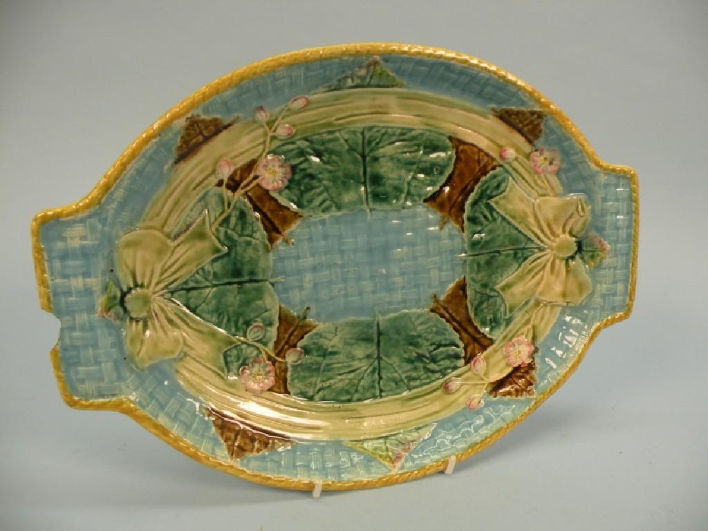 Appraisal: A Victorian Majolica dish with moulded decoration of ribbons and