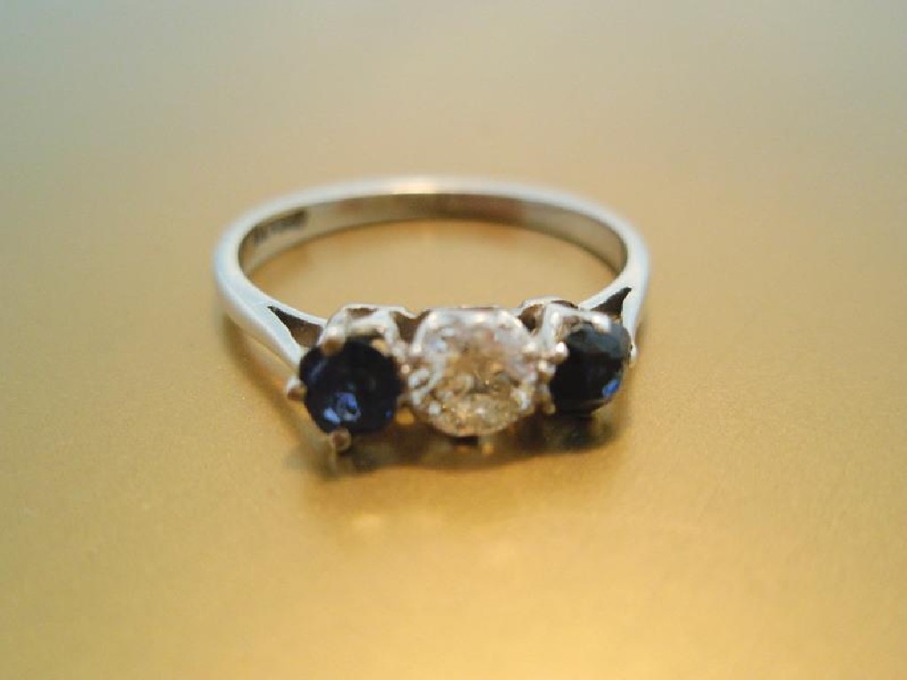 Appraisal: A stone ring of central diamond of ct approx flanked