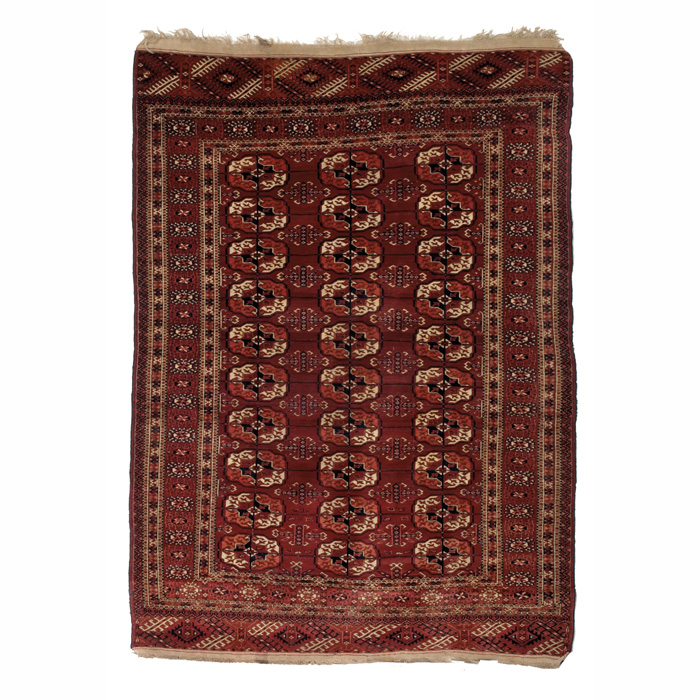 Appraisal: Turkoman rug c stylized floral design on a red field