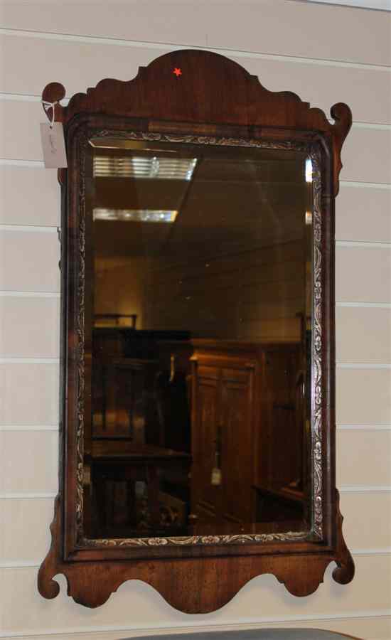 Appraisal: A George III mahogany fret cut wall mirror with later