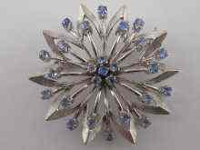 Appraisal: A white metal tests carat white gold flower brooch set