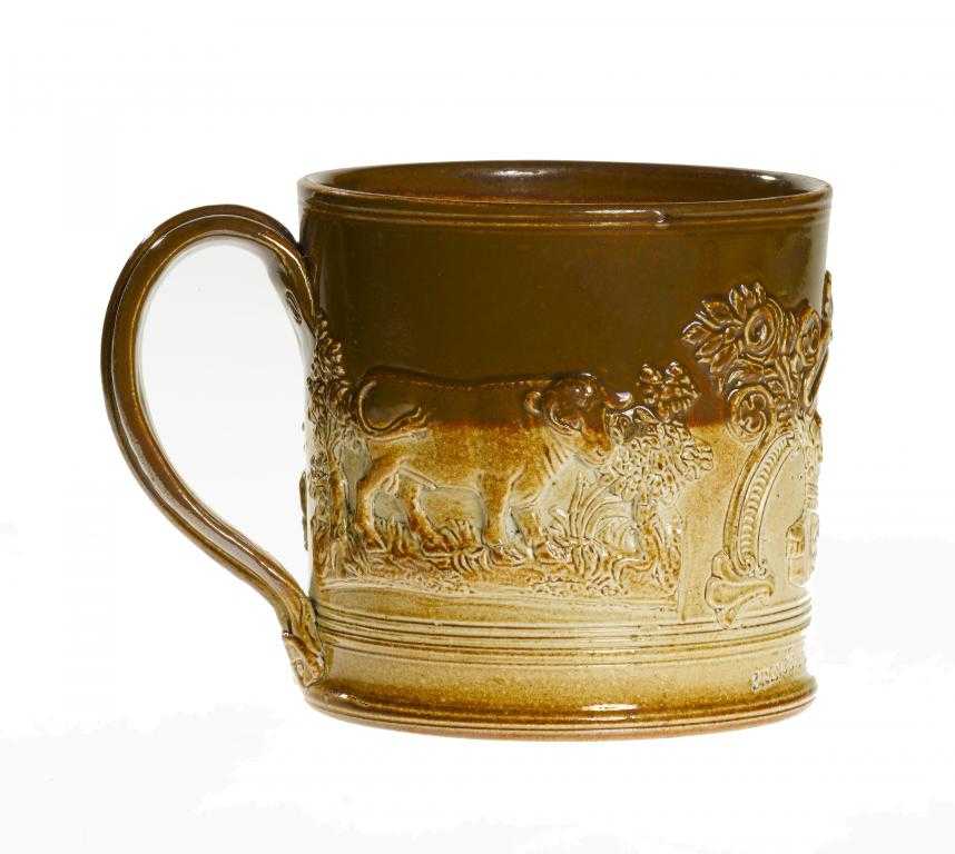 Appraisal: A DERBYSHIRE SALTGLAZED BROWN STONEWARE COMMEMORATIVE PORTER MUG sprigged with