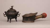 Appraisal: Pair of Metal Items Chinese Lot includes a small bronze