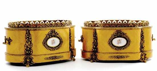 Appraisal: Pair Continental gilt-bronze mounted satinwood jardinieres serpentine form with bronze