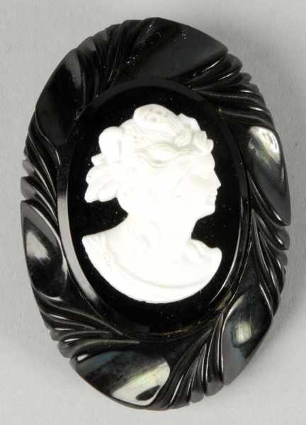 Appraisal: Bakelite Pin with White Cameo Condition Excellent Size - L