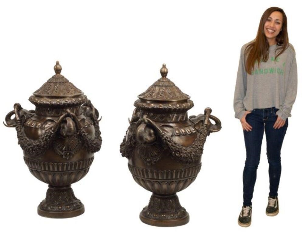 Appraisal: pair Large patinated bronze covered urns with elephant heads supporting