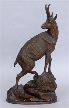 Appraisal: GERMAN CARVED WOOD FIGURE OF A MOUNTAIN GOAT Climbing on