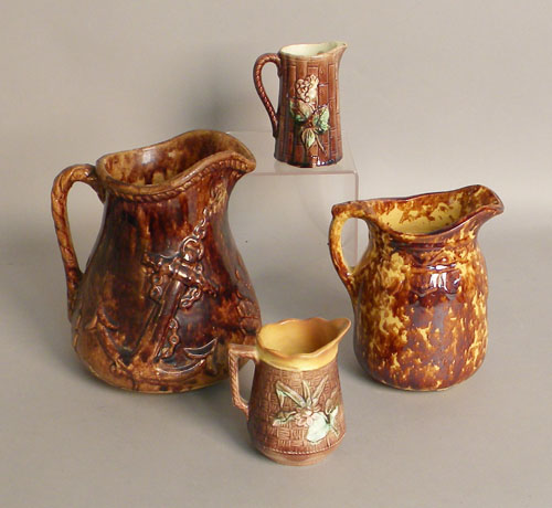 Appraisal: Two Rockingham glaze pitchers th c h h together with