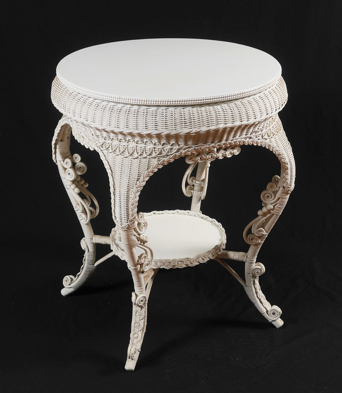 Appraisal: WHITE WICKER ROUND TABLE Round wood top shaped skirt legs