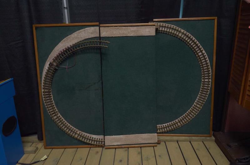 Appraisal: Electric Train Track on Wood Base Featuring gravel track mount