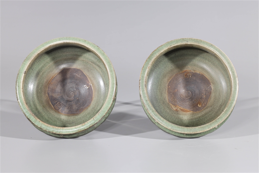 Appraisal: Pair of Chinese celadon ceramic tripod censers some wear some